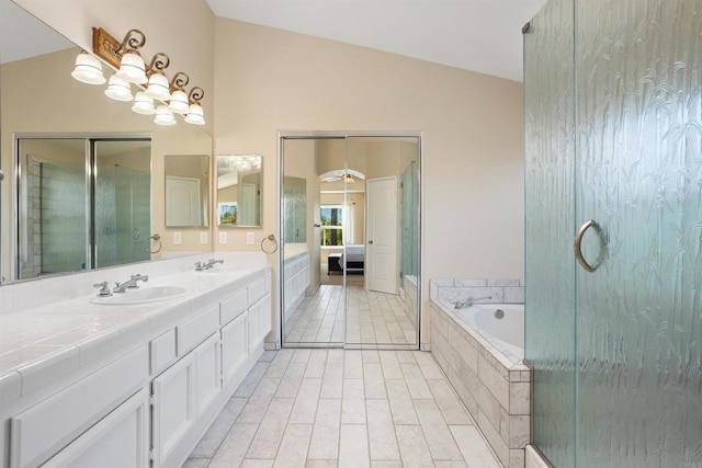 943 Masters Dr, Oceanside, CA 92057 - ensuite bathroom with double vanity, a garden tub, vaulted ceiling, and a shower with shower door