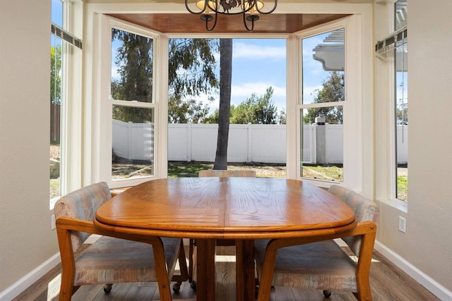 943 Masters Dr, Oceanside, CA 92057 - dining room featuring wood finished floors, a chandelier, and a textured wall