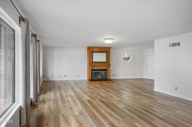 2524 Monaco Dr, Oxnard, CA 93035 - unfurnished living room featuring a large fireplace and light wood-type flooring