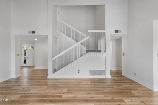 2524 Monaco Dr, Oxnard, CA 93035 - stairway featuring a high ceiling and wood finished floors