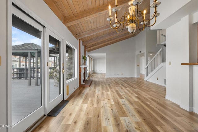 2524 Monaco Dr, Oxnard, CA 93035 - empty room with a wood ceiling with exposed beams, a chandelier, light wood finished floors, stairway, and high vaulted ceiling