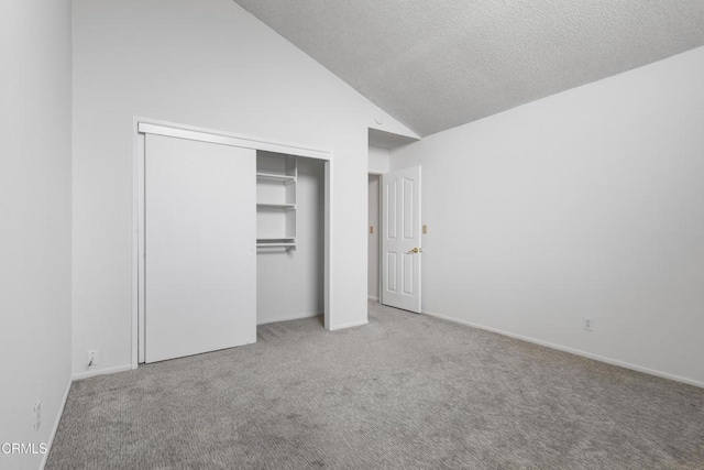 2524 Monaco Dr, Oxnard, CA 93035 - unfurnished bedroom with carpet floors, a closet, high vaulted ceiling, and a textured ceiling