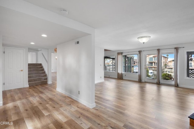 2524 Monaco Dr, Oxnard, CA 93035 - empty room with a smoke detector, light wood-style floors, recessed lighting, and stairway