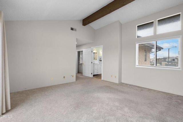 2524 Monaco Dr, Oxnard, CA 93035 - unfurnished bedroom featuring beam ceiling, light colored carpet, high vaulted ceiling, and connected bathroom