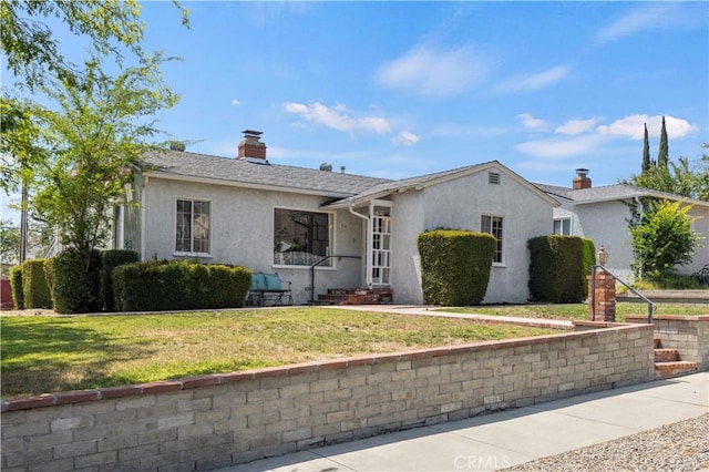 2505 N Keystone St, Burbank, CA 91504 - ranch-style home featuring stucco siding, a chimney, and a front yard