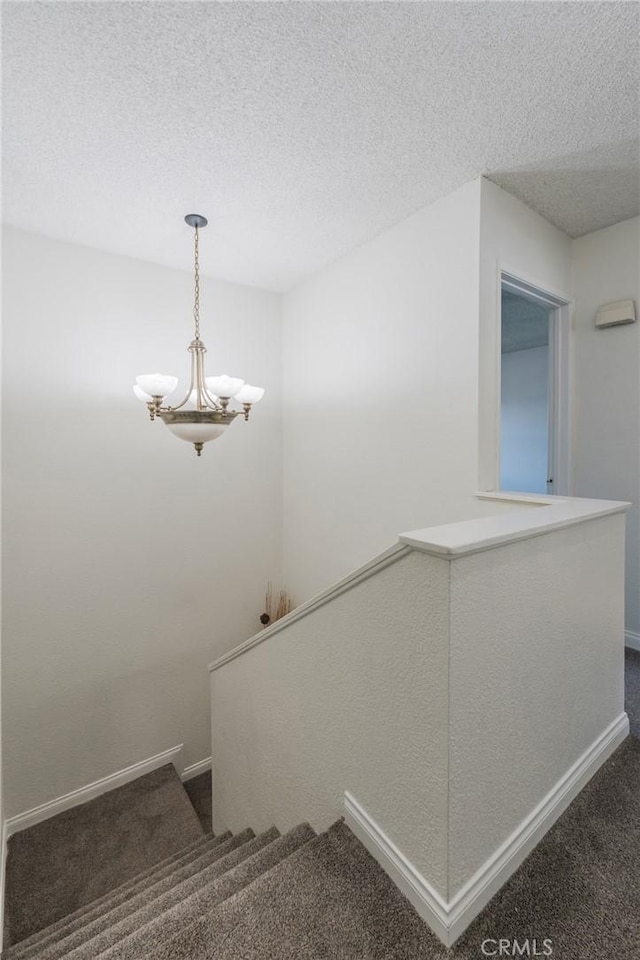 1219 221st St W, Torrance, CA 90502 - stairs with carpet flooring, a chandelier, and a textured ceiling