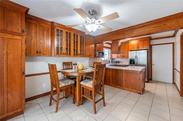 1219 221st St W, Torrance, CA 90502 - dining space with a ceiling fan, a textured ceiling, ornamental molding, and light tile patterned floors