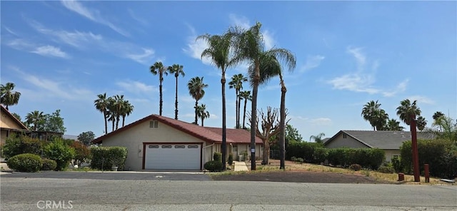 25105 Via Von Batsch, Moreno Valley, CA 92557 - ranch-style home featuring an attached garage, stucco siding, and driveway