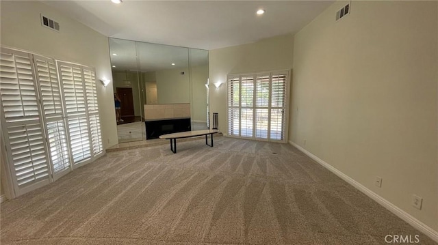 25105 Via Von Batsch, Moreno Valley, CA 92557 - unfurnished living room with carpet, recessed lighting, and a fireplace with raised hearth