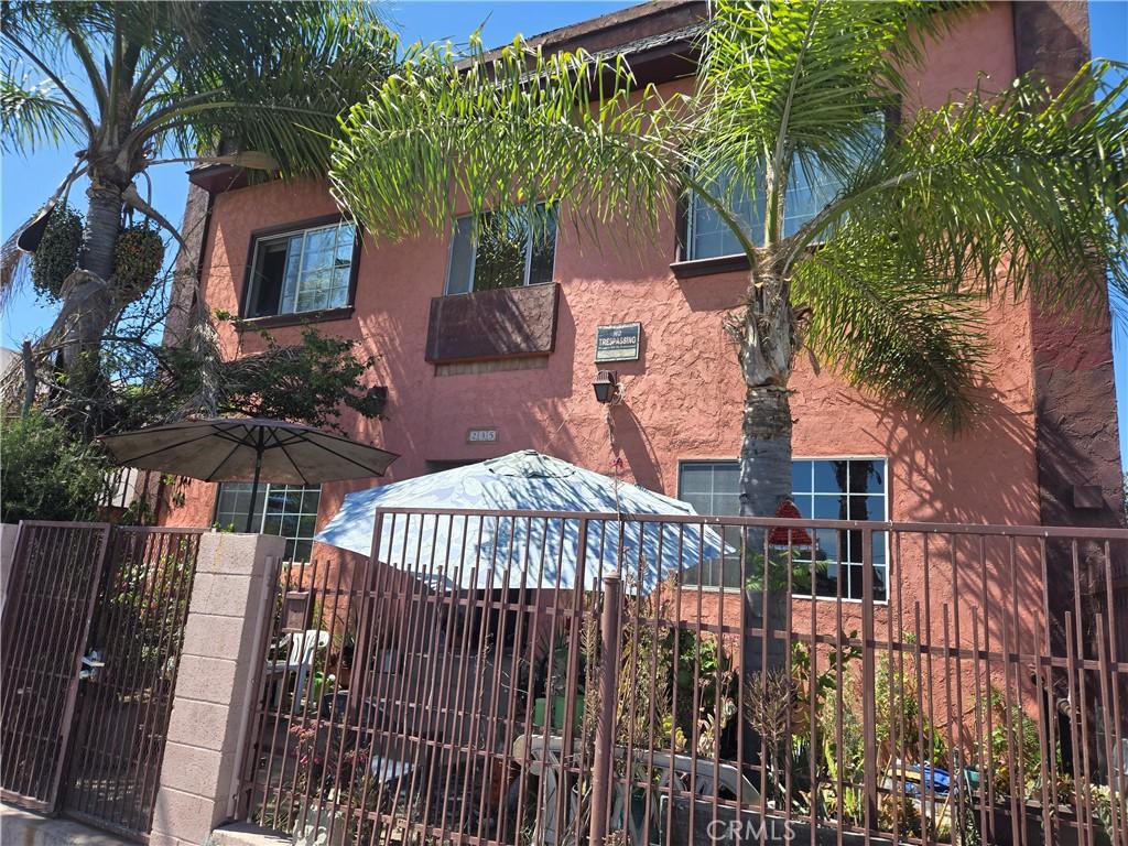235 E Anaheim St, Wilmington, CA 90744 - view of front of house with a gate