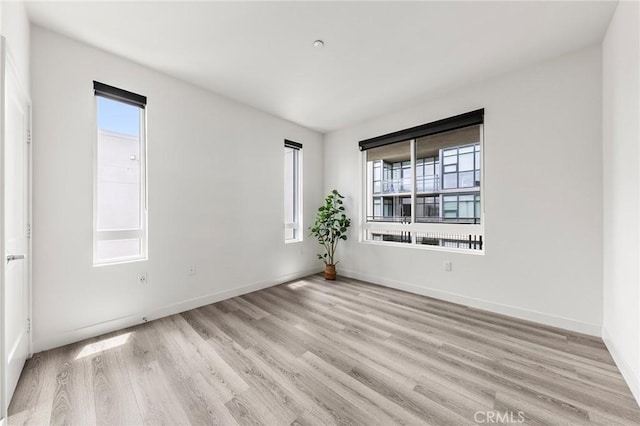 2526 Nolita, Irvine, CA 92612 - spare room with light wood-type flooring and healthy amount of natural light