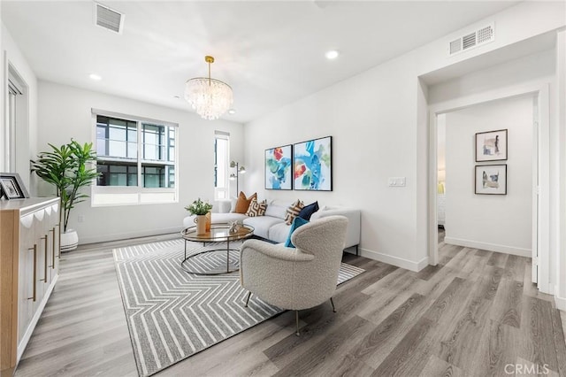 2526 Nolita, Irvine, CA 92612 - living area with light wood-style floors, a chandelier, and recessed lighting