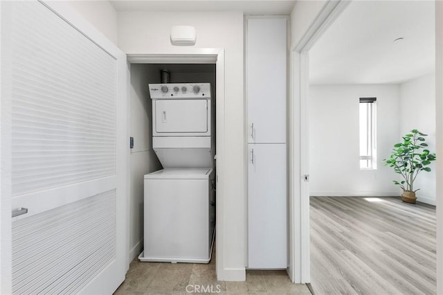 2526 Nolita, Irvine, CA 92612 - laundry room with stacked washing machine and dryer and baseboards