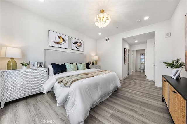 2526 Nolita, Irvine, CA 92612 - bedroom featuring light wood-type flooring, recessed lighting, and a chandelier