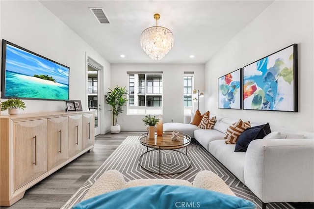 2526 Nolita, Irvine, CA 92612 - living area featuring wood finished floors, a chandelier, and recessed lighting