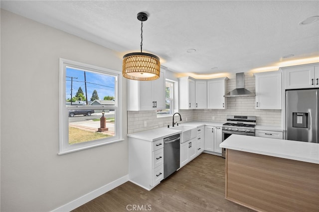 1514 E Palm Ave, Orange, CA 92866 - kitchen featuring appliances with stainless steel finishes, wall chimney exhaust hood, backsplash, dark wood-style flooring, and light countertops