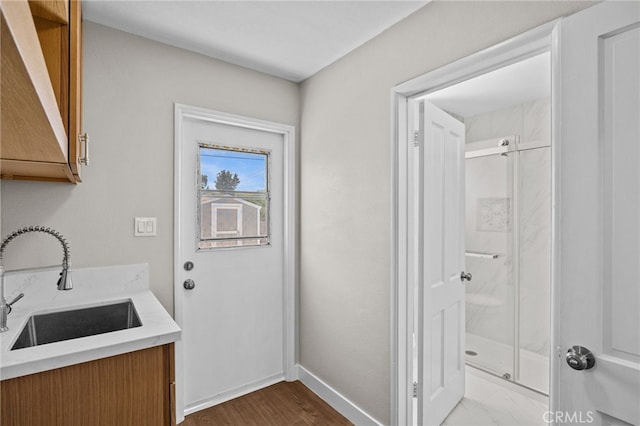 1514 E Palm Ave, Orange, CA 92866 - washroom featuring a sink and dark wood-type flooring