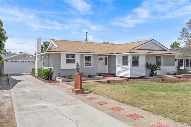 1514 E Palm Ave, Orange, CA 92866 - single story home featuring a front yard, a garage, an outbuilding, roof with shingles, and concrete driveway