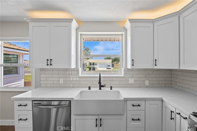1514 E Palm Ave, Orange, CA 92866 - kitchen featuring stainless steel dishwasher, tasteful backsplash, white cabinetry, and a textured ceiling