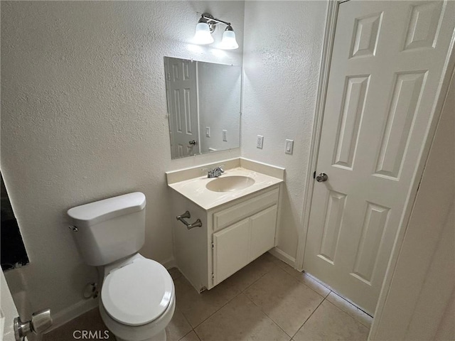 6162 Chia Ave Unit 29, Palms, CA 92277 - half bathroom with vanity, tile patterned floors, and a textured wall