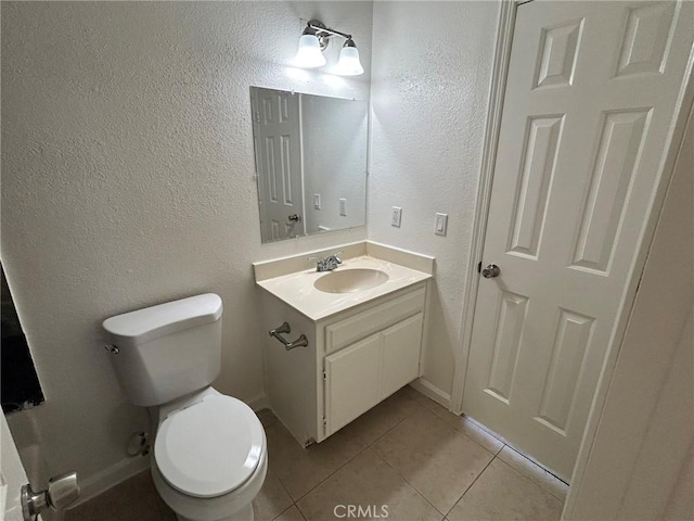 6162 Chia Ave Unit 29, Palms, CA 92277 - bathroom featuring vanity, tile patterned floors, and a textured wall