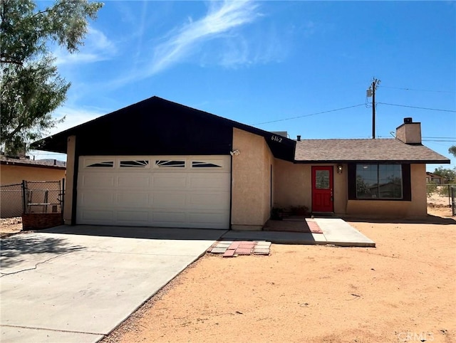 6162 Chia Ave Unit 29, Palms, CA 92277 - ranch-style home with driveway, stucco siding, a garage, and a chimney