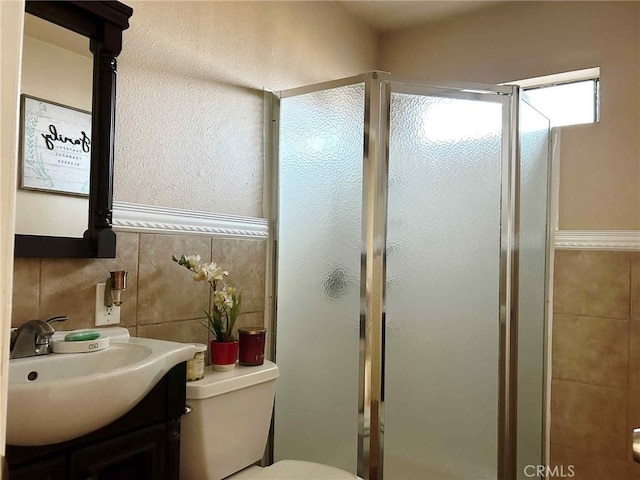 3653 Denver Ave, Long Beach, CA 90810 - full bathroom featuring a shower stall, vanity, and tile walls