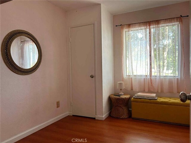 3653 Denver Ave, Long Beach, CA 90810 - bedroom featuring wood finished floors and multiple windows