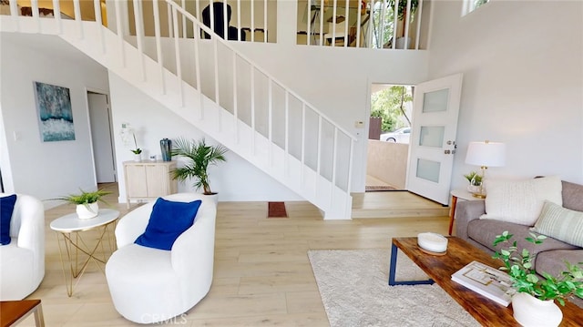 496 Crane Blvd, Los Angeles, CA 90065 - living area featuring a high ceiling, stairway, and wood finished floors