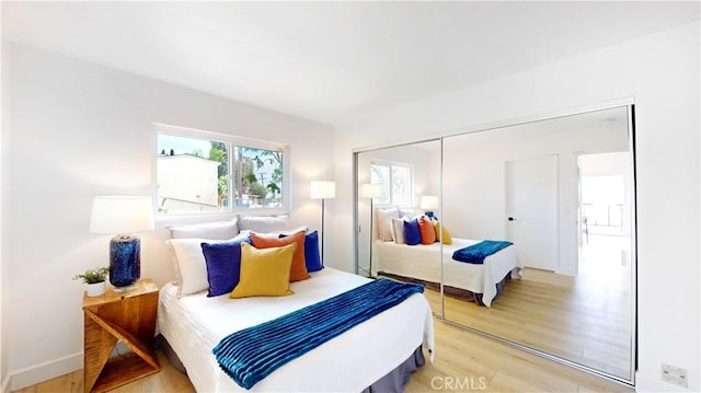 496 Crane Blvd, Los Angeles, CA 90065 - bedroom with light wood finished floors and a closet