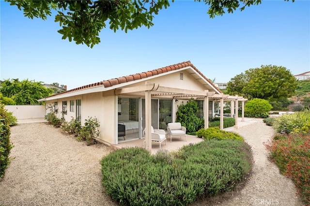 1606 Reef View Cir, Corona Del Mar, CA 92625 - back of property featuring a pergola, stucco siding, a tiled roof, and a patio area
