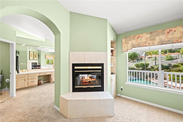 31148 Kahwea Rd, Temecula, CA 92591 - living room with plenty of natural light, a tile fireplace, and carpet