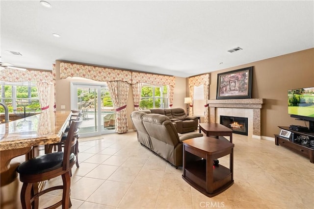 31148 Kahwea Rd, Temecula, CA 92591 - living room featuring a glass covered fireplace and light tile patterned floors