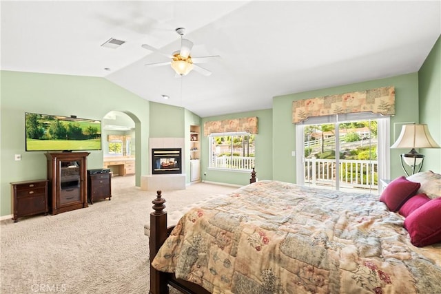 31148 Kahwea Rd, Temecula, CA 92591 - bedroom featuring access to outside, a tile fireplace, vaulted ceiling, carpet, and ceiling fan