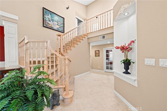 31148 Kahwea Rd, Temecula, CA 92591 - stairway with tile patterned flooring and a towering ceiling