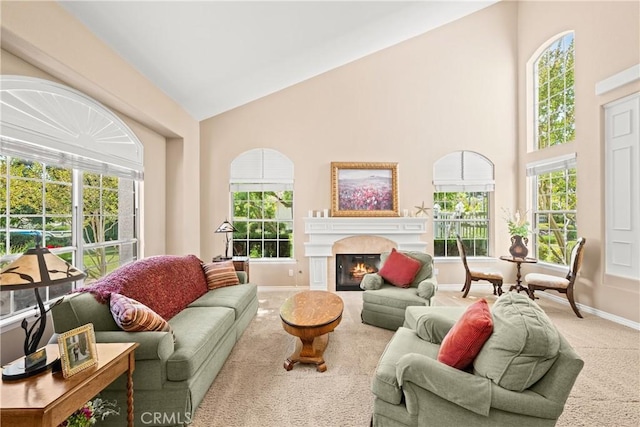 31148 Kahwea Rd, Temecula, CA 92591 - living area featuring carpet, high vaulted ceiling, and a glass covered fireplace
