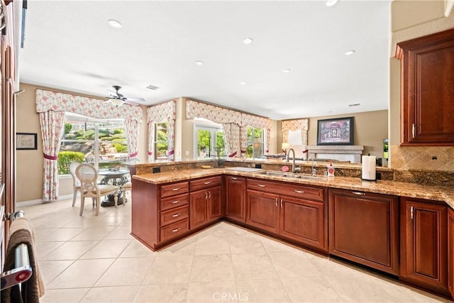 31148 Kahwea Rd, Temecula, CA 92591 - kitchen with ceiling fan, light stone countertops, light tile patterned floors, backsplash, and recessed lighting