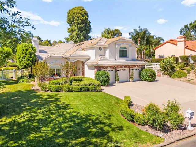 31148 Kahwea Rd, Temecula, CA 92591 - mediterranean / spanish home with a garage, driveway, stucco siding, and a chimney
