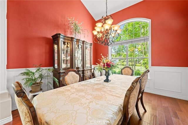 31148 Kahwea Rd, Temecula, CA 92591 - dining space with a chandelier, a wainscoted wall, hardwood / wood-style flooring, and high vaulted ceiling