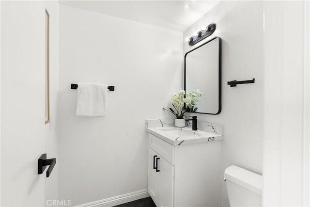 11338 Grand Manan Dr, Cypress, CA 90630 - half bathroom featuring toilet and vanity