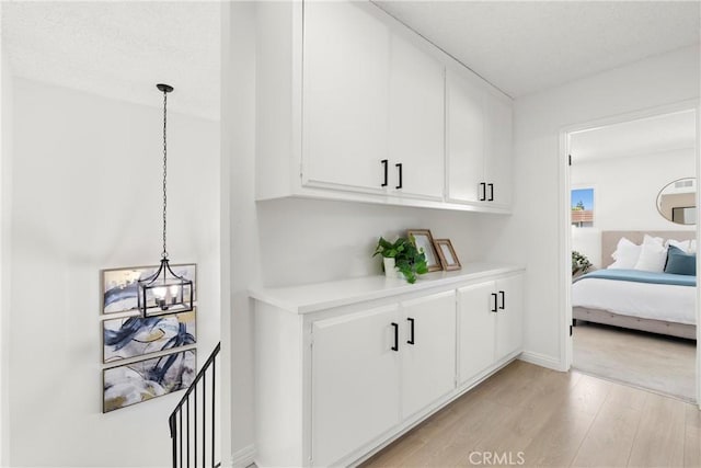 11338 Grand Manan Dr, Cypress, CA 90630 - bedroom with a chandelier and light wood-type flooring