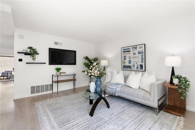 11338 Grand Manan Dr, Cypress, CA 90630 - living room with wood finished floors and baseboards
