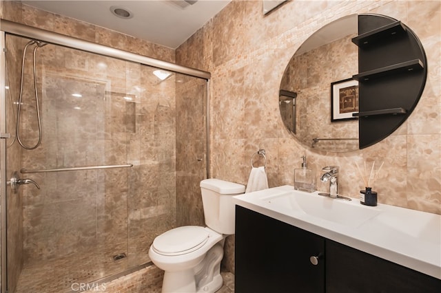 13632 Valerio St Unit 2, Van Nuys, CA 91405 - bathroom with tile walls, vanity, a shower stall, and backsplash