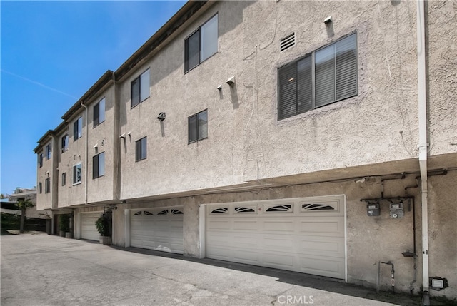 13632 Valerio St Unit 2, Van Nuys, CA 91405 - view of property with an attached garage