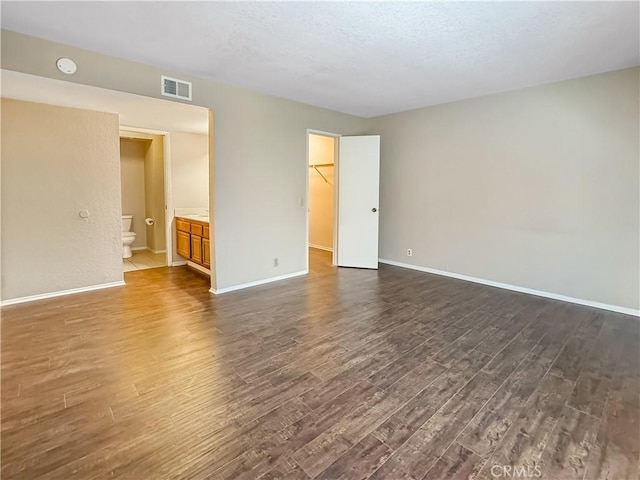 600 Central Ave Unit 323, Riverside, CA 92507 - empty room featuring dark wood-type flooring and a smoke detector