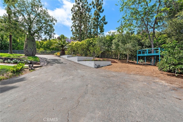 31842 Paseo Cielo, San Juan Capistrano, CA 92675 - view of asphalt driveway with view of scattered trees