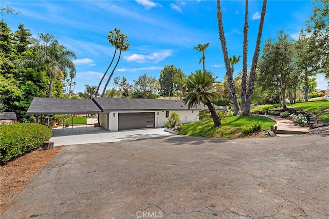 31842 Paseo Cielo, San Juan Capistrano, CA 92675 - view of front facade featuring a garage, concrete driveway, and a carport
