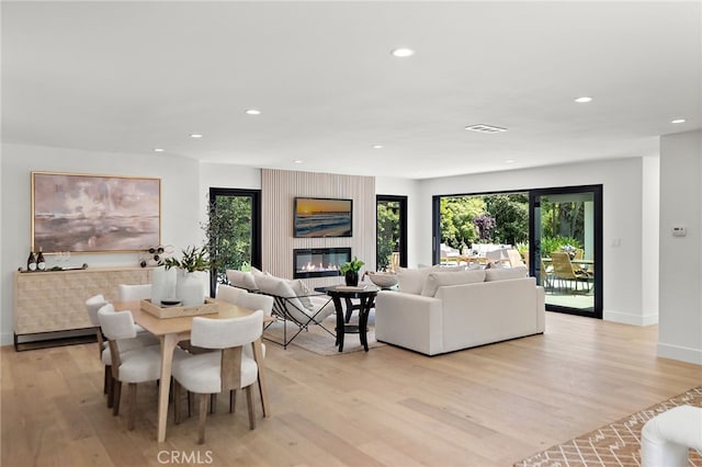 31842 Paseo Cielo, San Juan Capistrano, CA 92675 - dining space featuring light wood finished floors, recessed lighting, and a large fireplace
