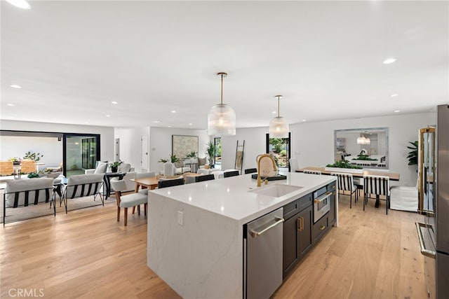 31842 Paseo Cielo, San Juan Capistrano, CA 92675 - kitchen featuring dishwasher, a center island with sink, light wood-style floors, plenty of natural light, and recessed lighting