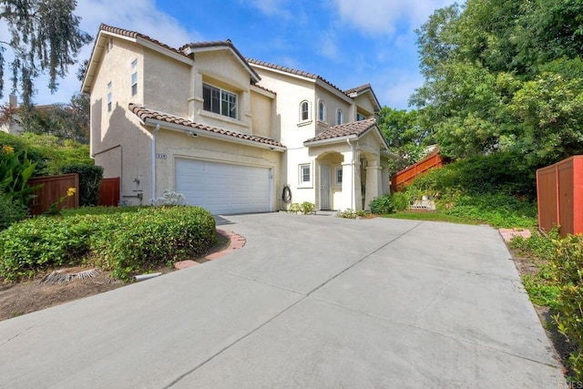 339 Diamante Way, Oceanside, CA 92056 - mediterranean / spanish house with driveway, a tile roof, stucco siding, and an attached garage